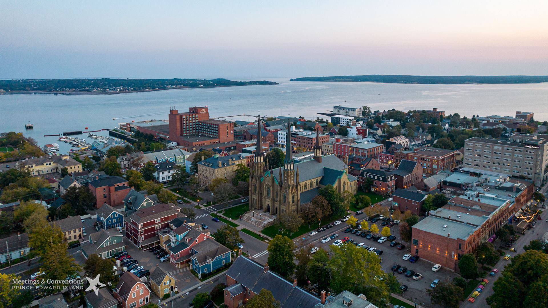 Aerial image of Charlottetown, PEI at dusk. View of the Delta PEI and the harbour. Image provided by Tourism PEI.